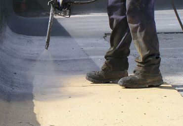 Coating systems over Santa Fe spray foam roof systems